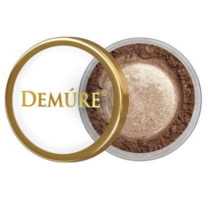 Open container of Demure Brownstone Sparkle eye color with gold lid on a white background