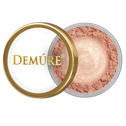 Open container of Demure Golden Coral eye color with gold lid on a white background
