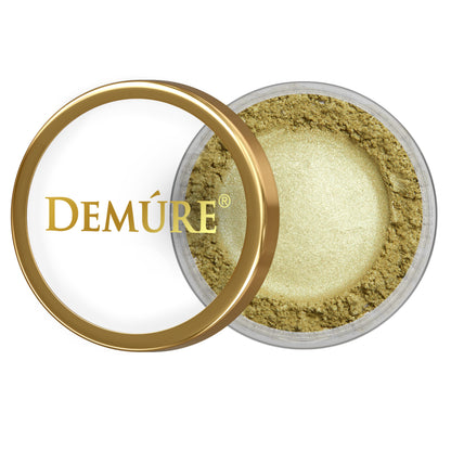 Open container of Demure Lime eye color with gold lid on a white background