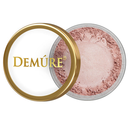 Open container of Demure Pink Passion eye color with gold lid on a white background