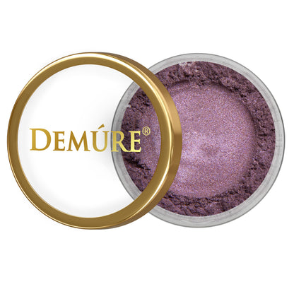 Open container of Demure Violet eye color with gold lid on a white background