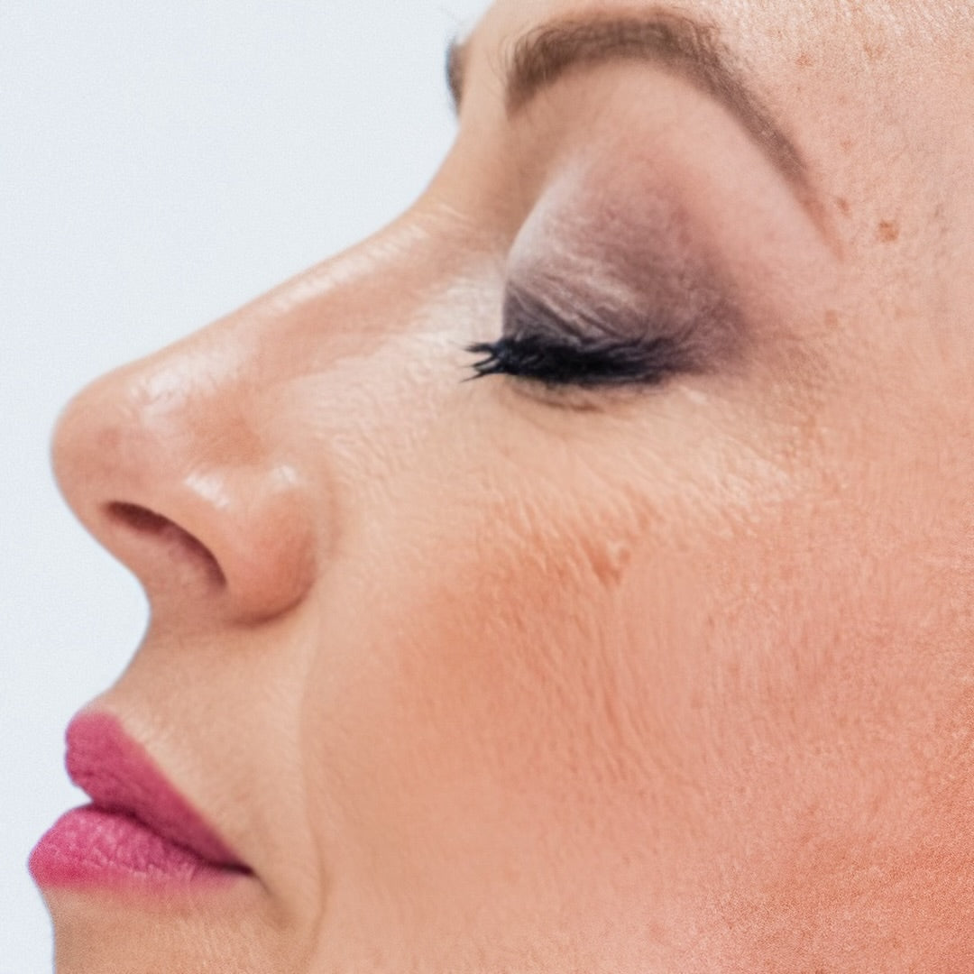 Close-up of a woman's face focused on the eye area wearing Demure Black Eye Liner. 