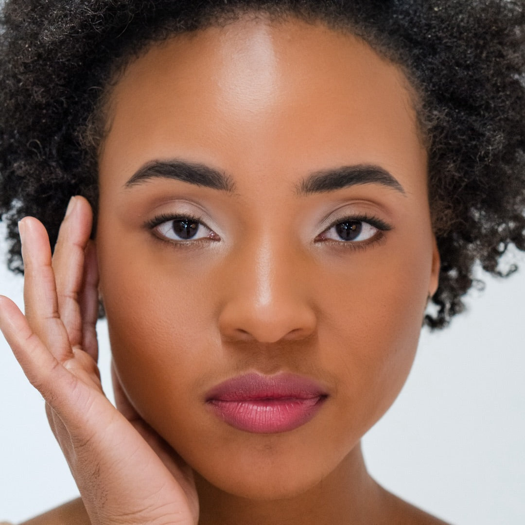 African American woman wearing Demure Earth 47 Eye Liner 