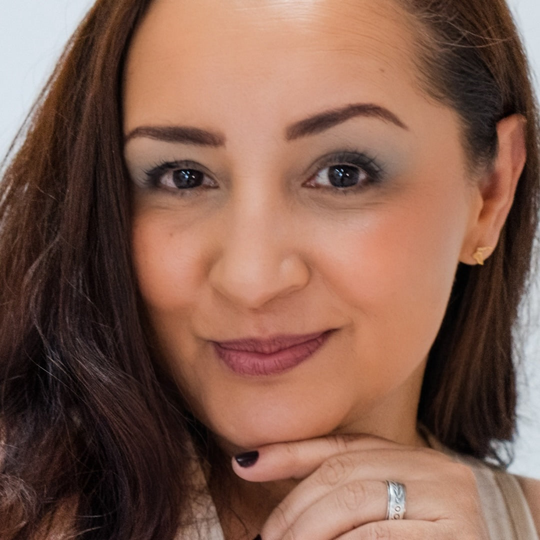 Latino woman wearing Demure Dark Brown Brow liner