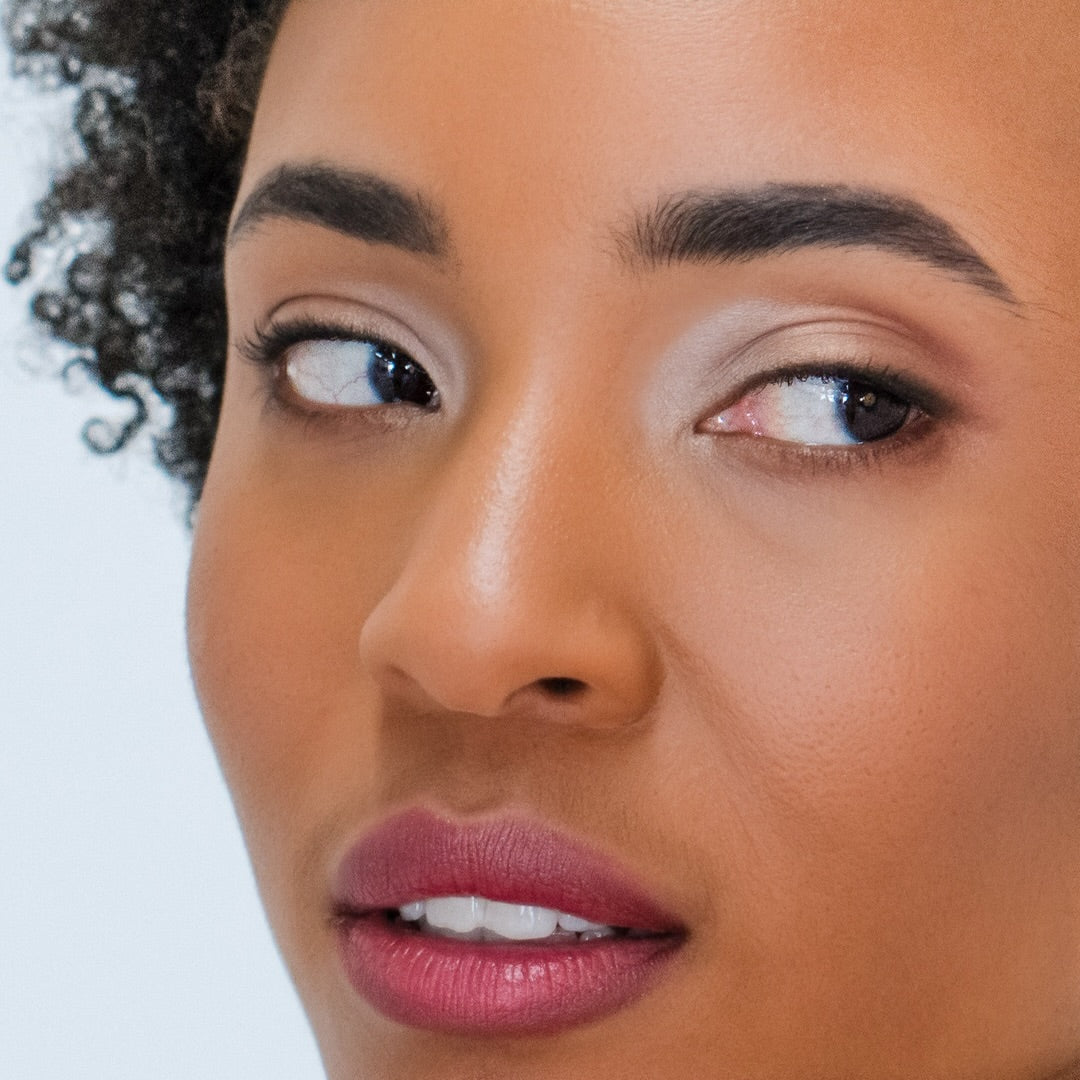 Woman wearing Demure Naked Glow Eye Color, Golden Coral Eye Color and Sienna Eye Colors.