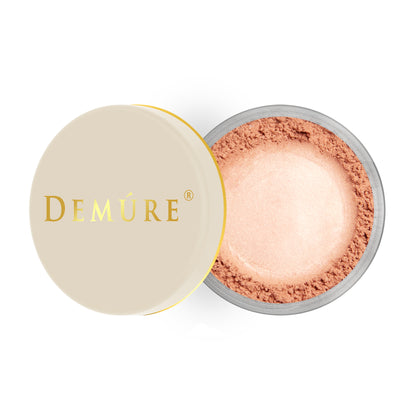 Open container of Demure Bloom color loose blush with a gold lid