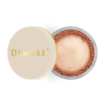 Open container of Demure Go Bronze color loose blush with a gold lid