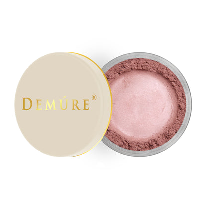 Open container of Demure Mauve color loose blush with a gold lid