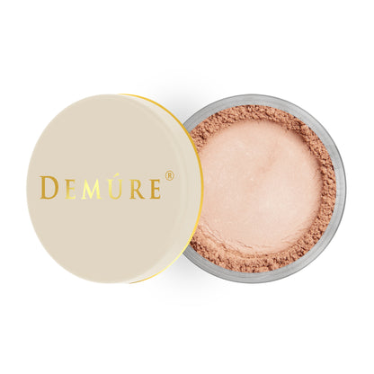 Open container of Demure Natural Radiance color loose blush with a gold lid