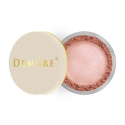 Open container of Demure Satin Rose color loose blush with a gold lid
