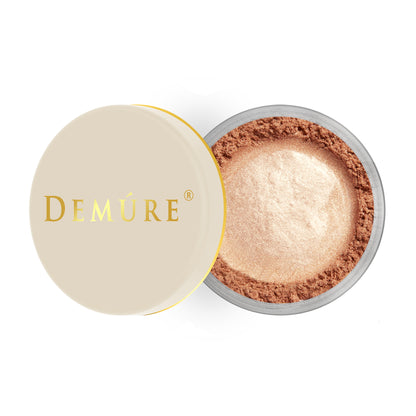 Open container of Demure Face & Body Bronzer with a gold lid