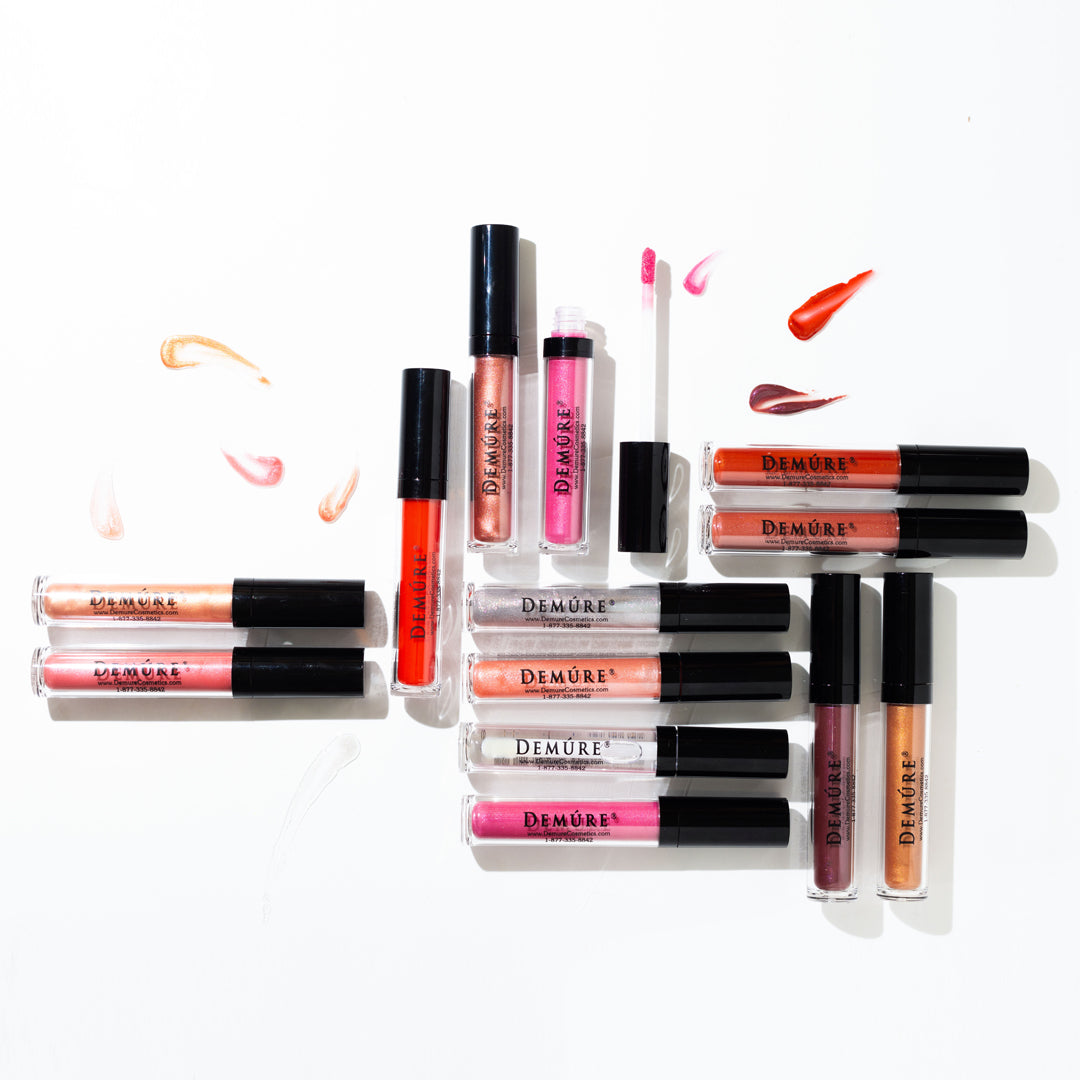 A bird's eye view image of Demure Lip Gloss colors with gloss swatches.