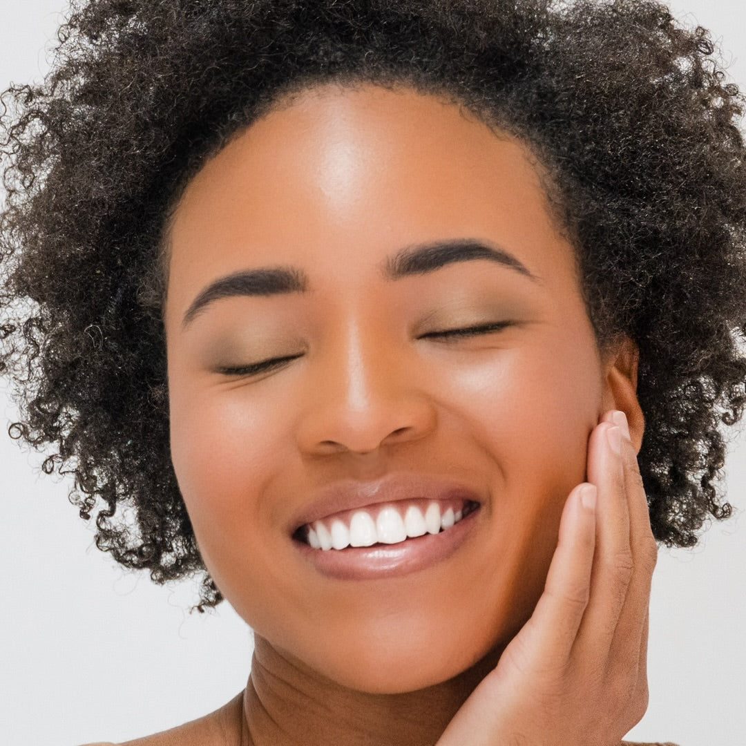 African American woman wearing Demure Eye Colors Lime, Golden Brown and Moss.