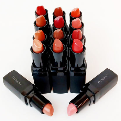 Collection of Demure lipsticks in various shades on a white background