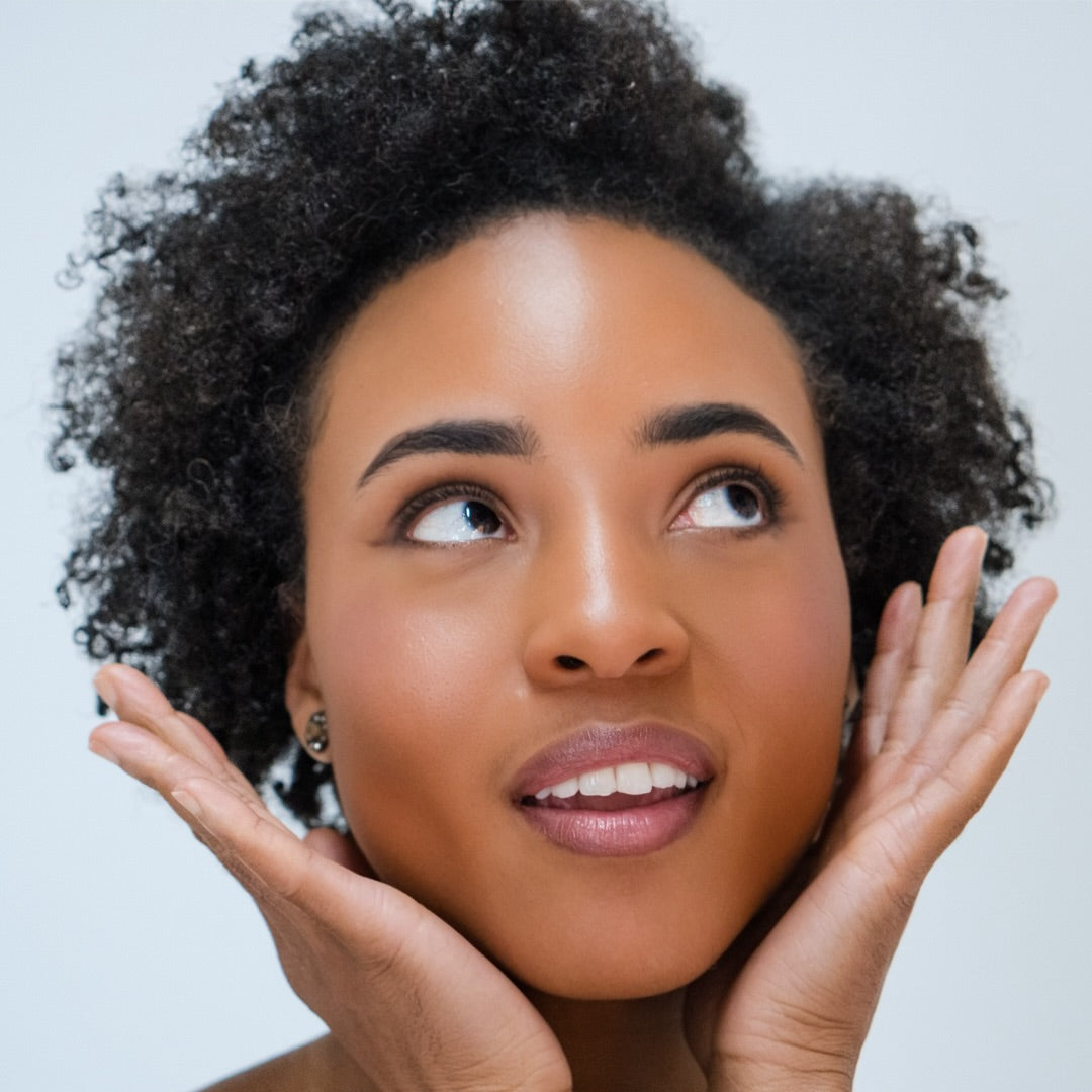 African American woman wearing Demure Medium Dark Warm Foundation 