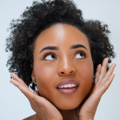 African American woman wearing Demure Medium Dark Warm Foundation 