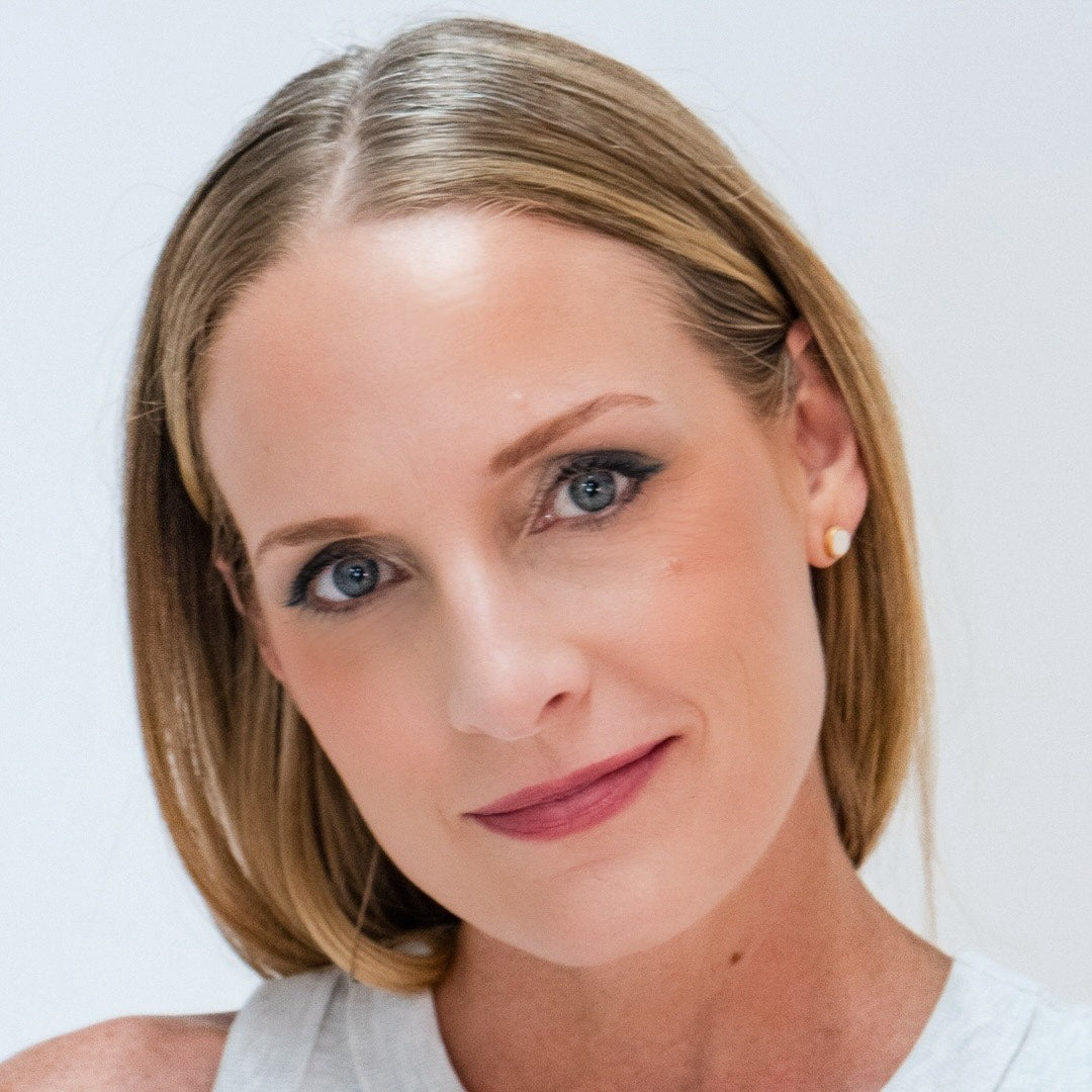 Close-up of a woman wearing Demure Strawberry Blush and Medium Foundation