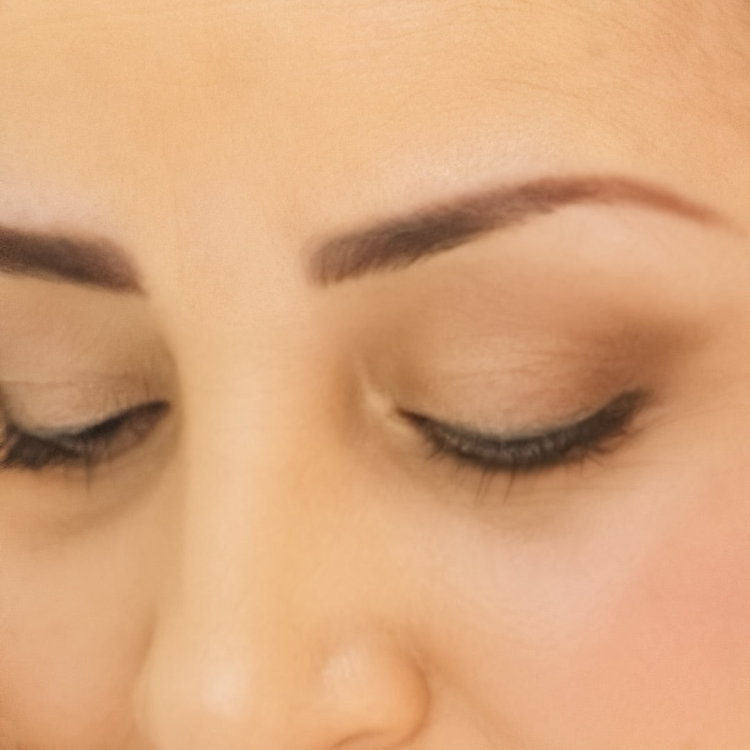 Close up of woman's eyes wearing Demure Eye Colors Pink Copper, Gold Shimmer & Brown Liner.