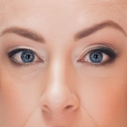 Close-up of a woman's face with a wearing Demure Eye Brow Liner in Taupe