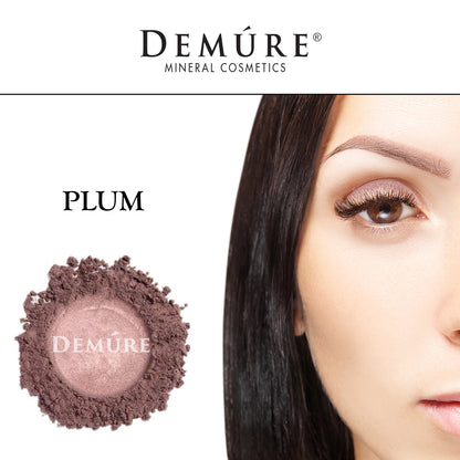 Woman's face close up with Plum eye color on her eye lid