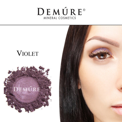Woman's face close up with Violet eye color on her eye lid