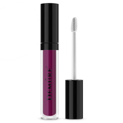 A tube of Demure Matte Liquid Lipstick Black Cherry 106 with a black cap, alongside an application brush.