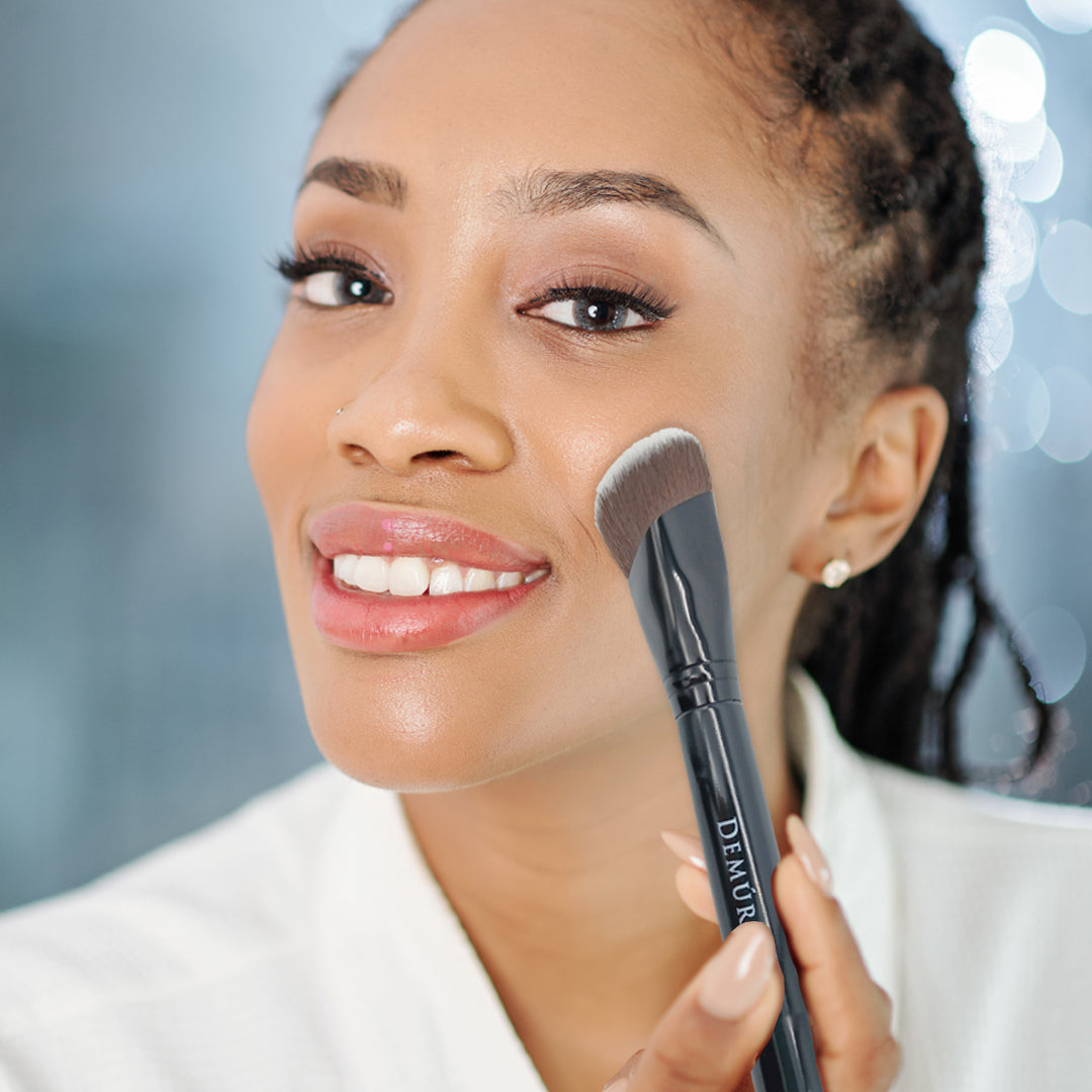Woman using the Demure Contour Brush
