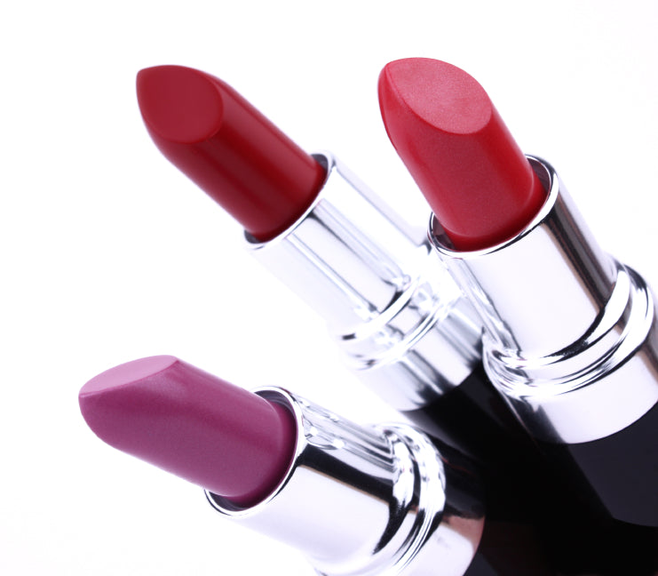 Three tubes of different color lipsticks