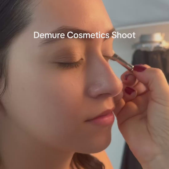 Video of makeup artist applying Demure makeup to a model.