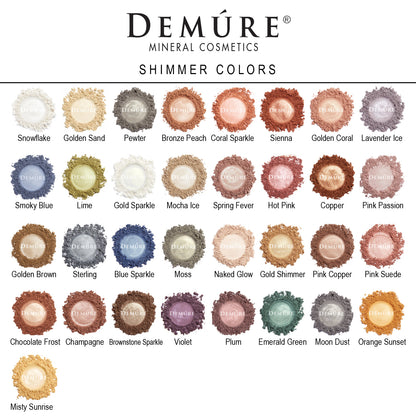 Photo of samples of Demure's mineral cosmetics "Shimmer Colors" product line in various shades, including snowflake, golden sand, pewter, mocha ice, naked glow, plum, emerald green, etc.