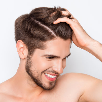 Man running his fingers through clean hair.