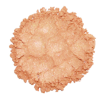 A swatch of Limited Edition #9 Peach mineral eye color, showing a matte finish peachy eyeshadow.