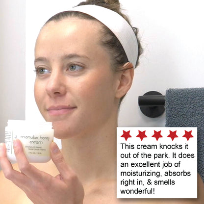 A smiling woman holding an open jar of Deluvia Manuka Honey Cream with a customer testimonial in the corner
