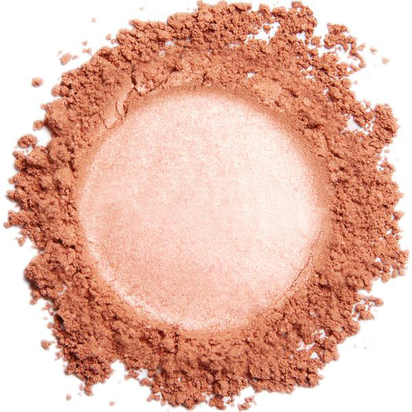 A swatch of coral sparkle mineral eye color powder, showing a rich pigmented shade with a shimmering finish.