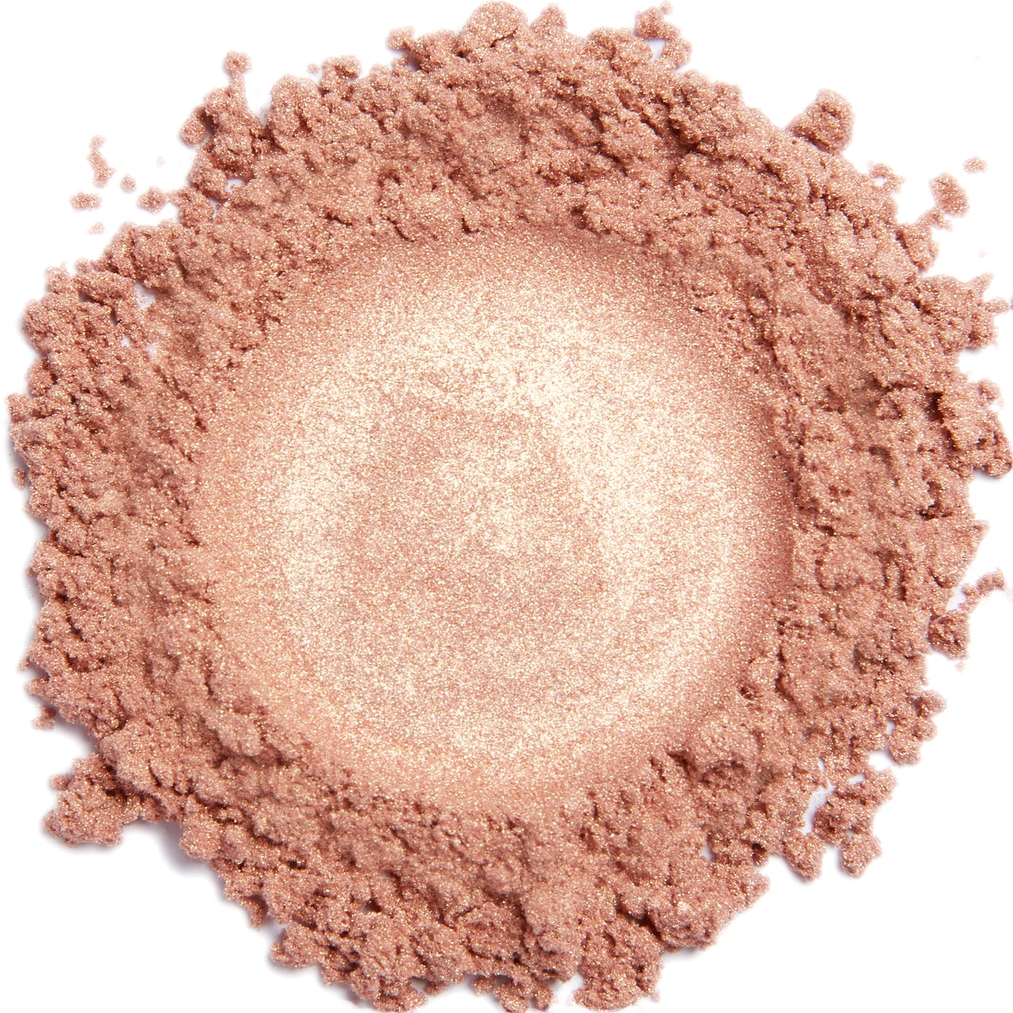 A close-up image of a light golden coral colored mineral eye shadow powder.