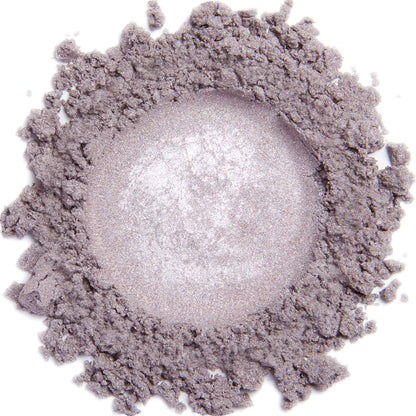 A close-up image of a lavender ice colored mineral eye shadow with a metallic finish.