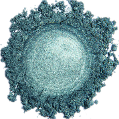 A close-up image of a blue-green Mermaid shimmer mineral eye color powder.