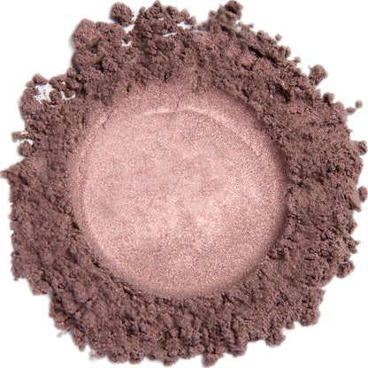 A close up swatch of Plum mineral eye shadow.