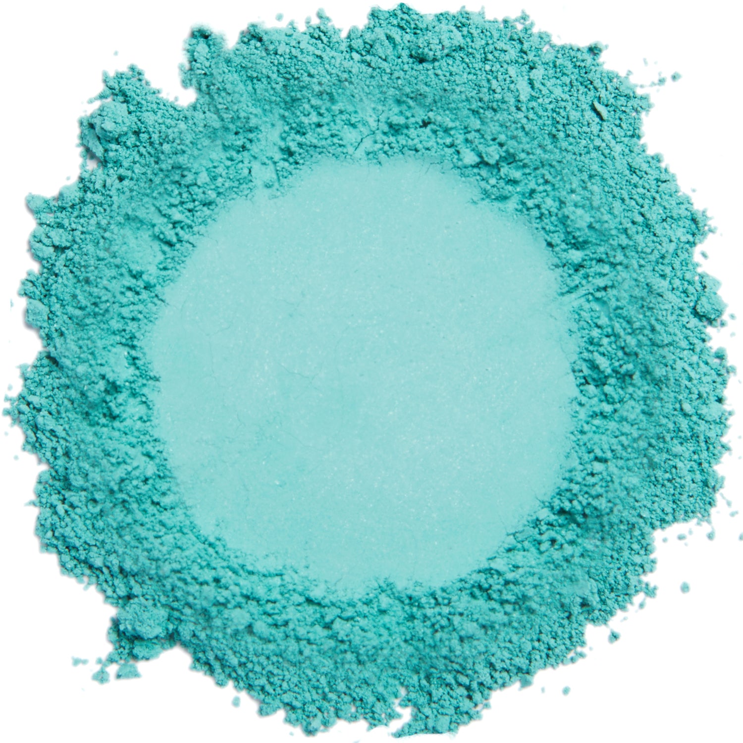 A close up swatch of Teal mineral eye shadow.
