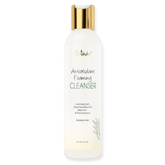 Photo of a bottle of Deluvia's paraben-free antioxidant foaming cleanser enriched with dead sea minerals, aloe vera, and plant extracts