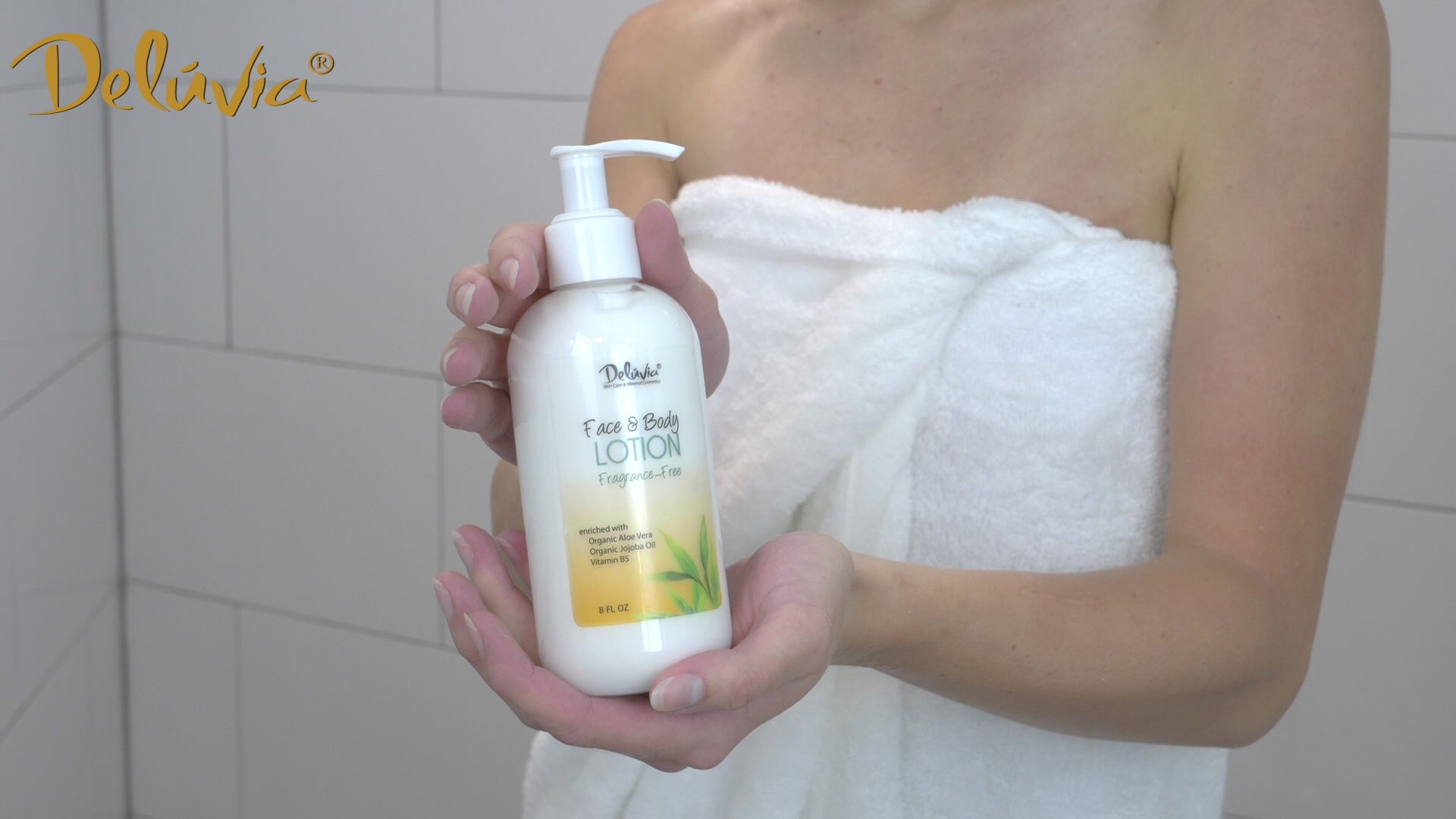 Video showing a woman using Deluvia Hand & Body Lotion
